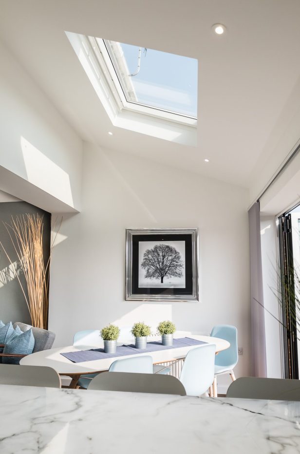 An internal view of the dining area with rooflight above, looking from the kitchen breakfast bar at Church Street.
