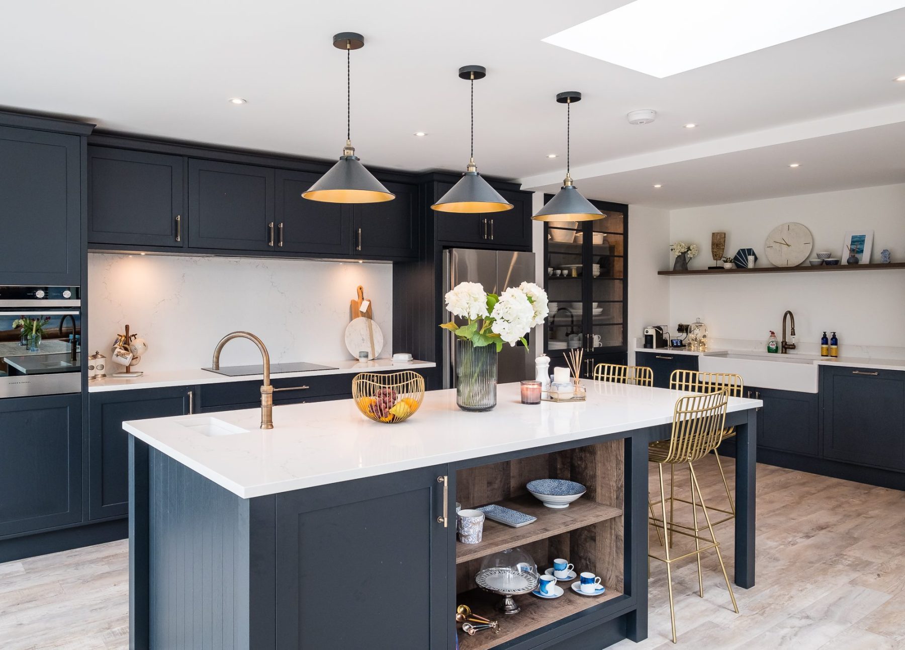 An internal view of a light-filled kitchen with a large skylight above at Topsham Road.