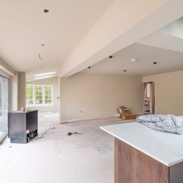 An internal view of the open plan dining area from the kitchen towards the entrance boot room at Nethercott in Silverton.