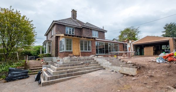 An external rear view looking up to the new entrance of the extension from the driveway at Nethercott in Silverton.